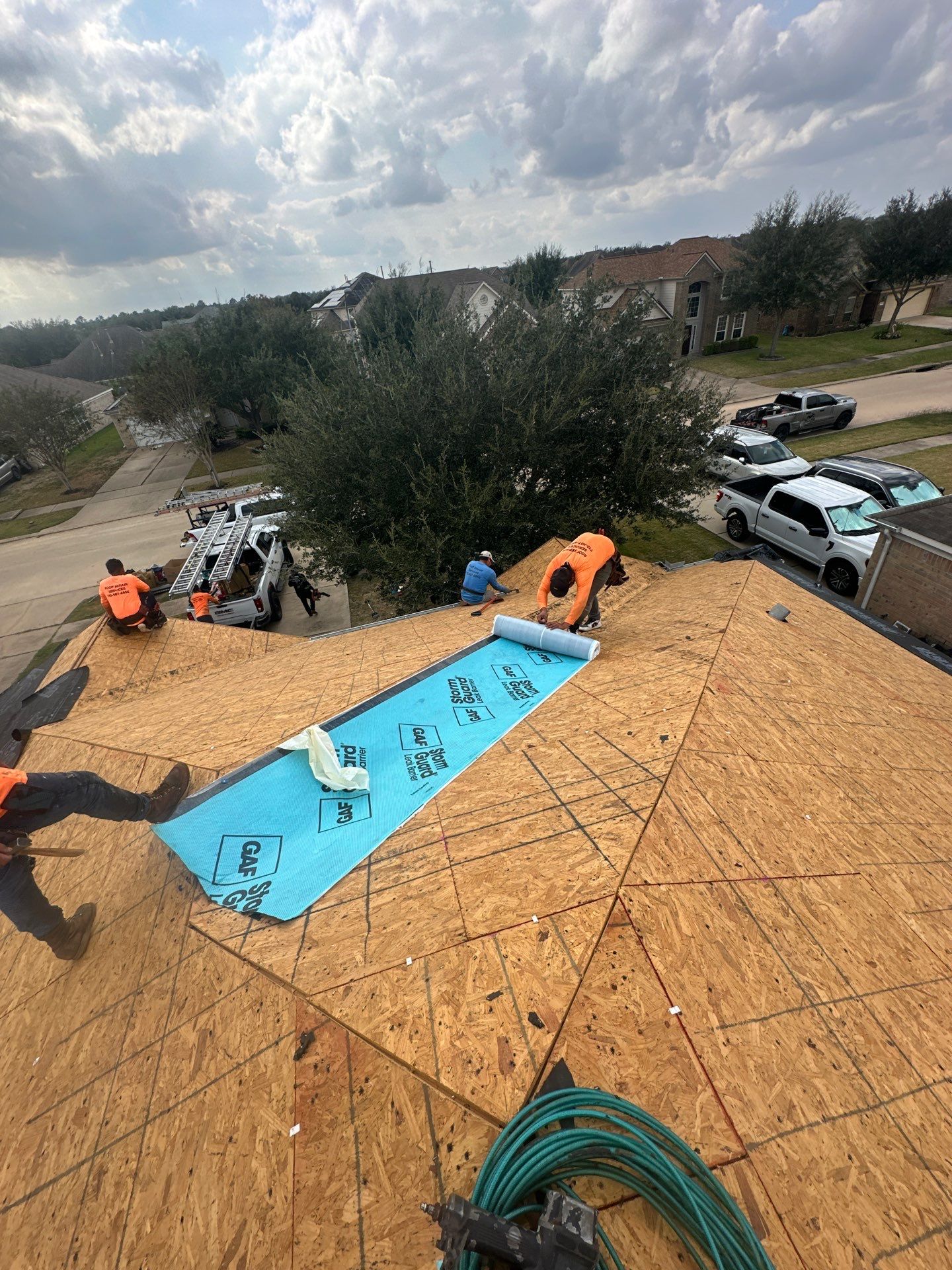 Missouri City, TX full roof replacement in progress — new decking, GAF StormGuard valley membrane, three-person crew from O&S Roof Repair